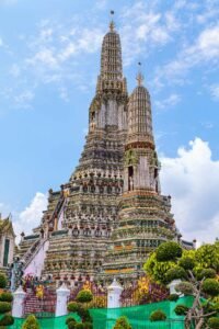 Wat Arun (Temple of Dawn) in Bangkok, Thailand covered in colorful porcelain. Must-Visit Temples in Bangkok.