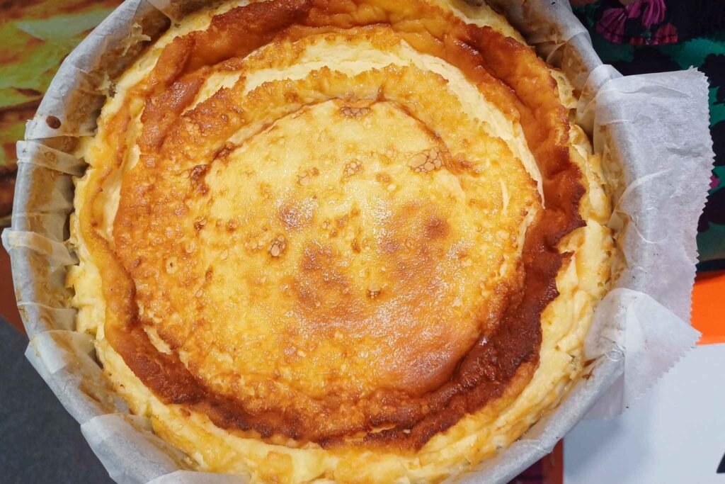 A pan of delicious cakes on a table at La Tarta de la Madre de Cris in Málaga, Spain. Best Places to Eat in Málaga.