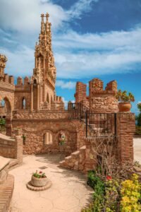 A large brick building, Castillo de Colomares, showcasing intricate architecture in Málaga, Spain. Best Things to Do in Málaga.
