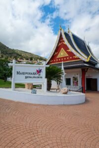 Entrance to the Pavilion at Mariposario de Benalmádena, surrounded by lush greenery in Málaga, Spain. Best Things to Do in Málaga.