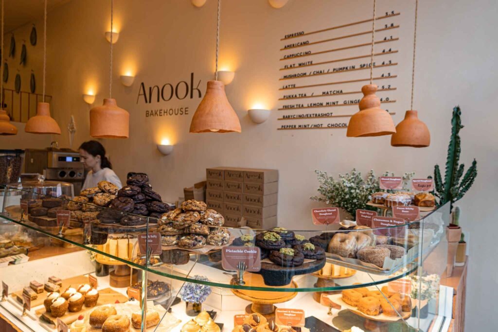 A vibrant bakery display at Anook Bakehouse in Amsterdam, showcasing a variety of delicious baked goods. Best Bakeries in Amsterdam.