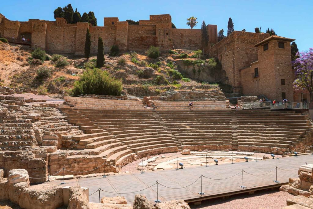 View of Teatro Romano de Málaga, Spain - Yati Travel View of the ancient Teatro Romano de Málaga, showcasing its historic architecture and surrounding landscape. Best Things to Do in Málaga.